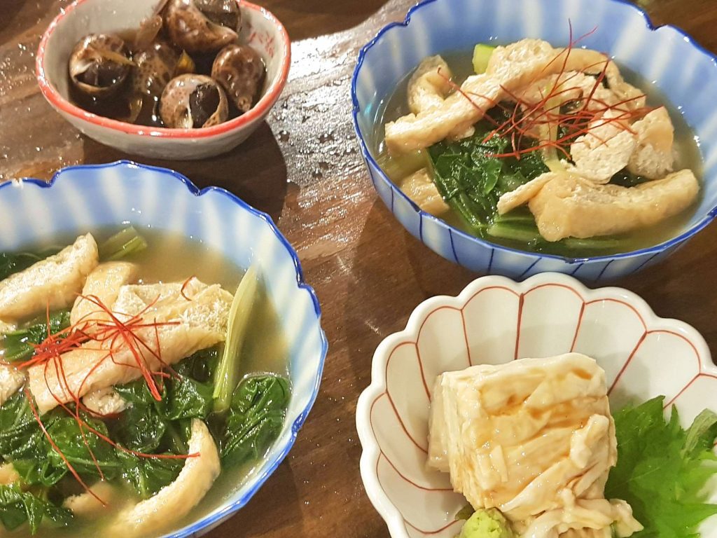 Slow simmered goodness across four different tiny bowls of food